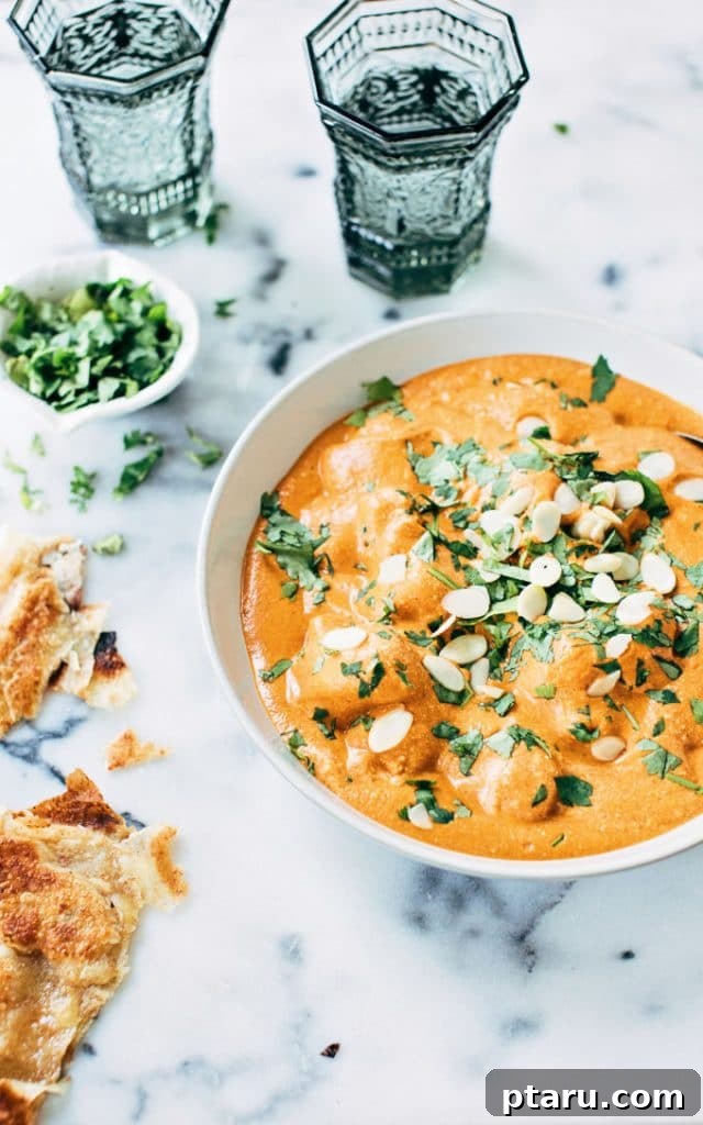 Vibrant Indian Vegetarian Dinner Ideas 4 Homemade Paneer Butter Masala in a bowl topped with cilantro and almonds.