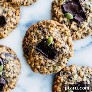 Wholesome Currant and Seed Cookies 6 A stack of 'healthy' seed and currant cookies with visible chocolate chunks.