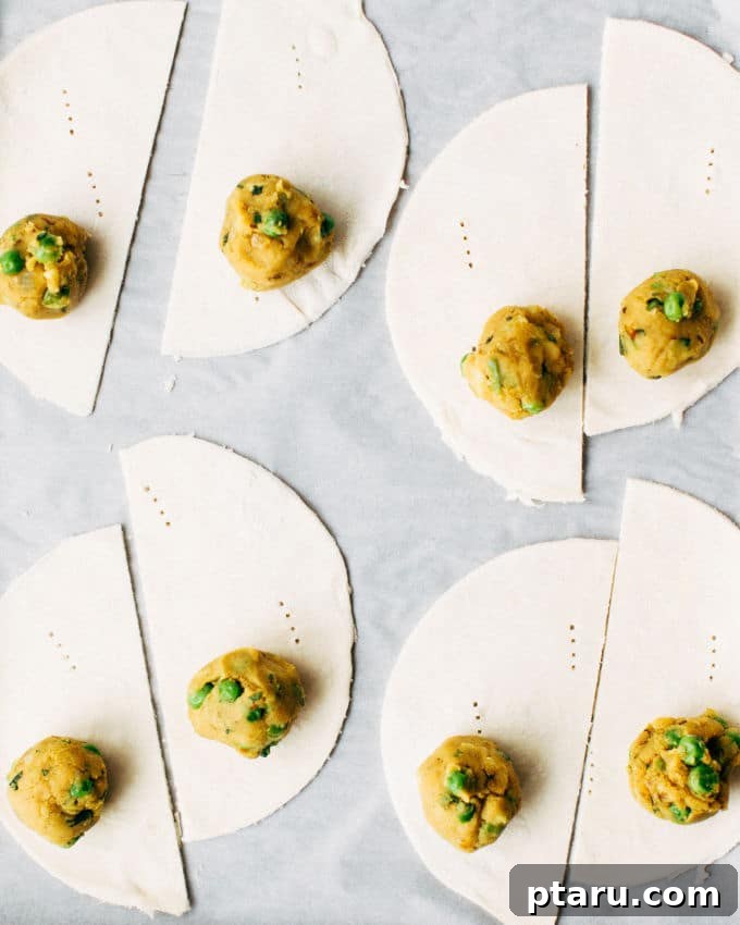 Effortless Flaky Samosas 8 Folding puff pastry around the potato filling to form a samosa