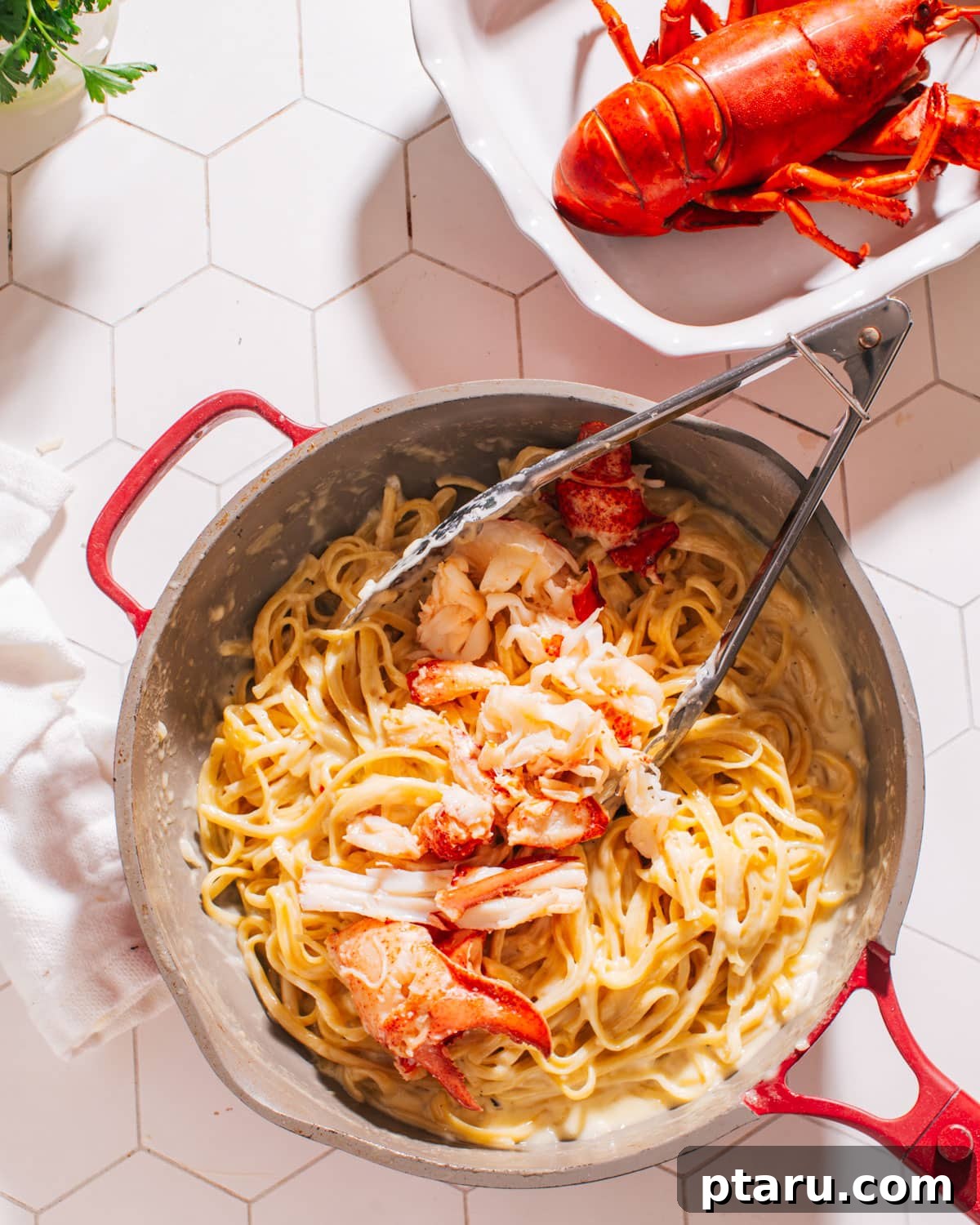 Decadent Lobster Pasta with White Wine Cream 6 Finished Lobster Pasta in a large pan, ready to be served.