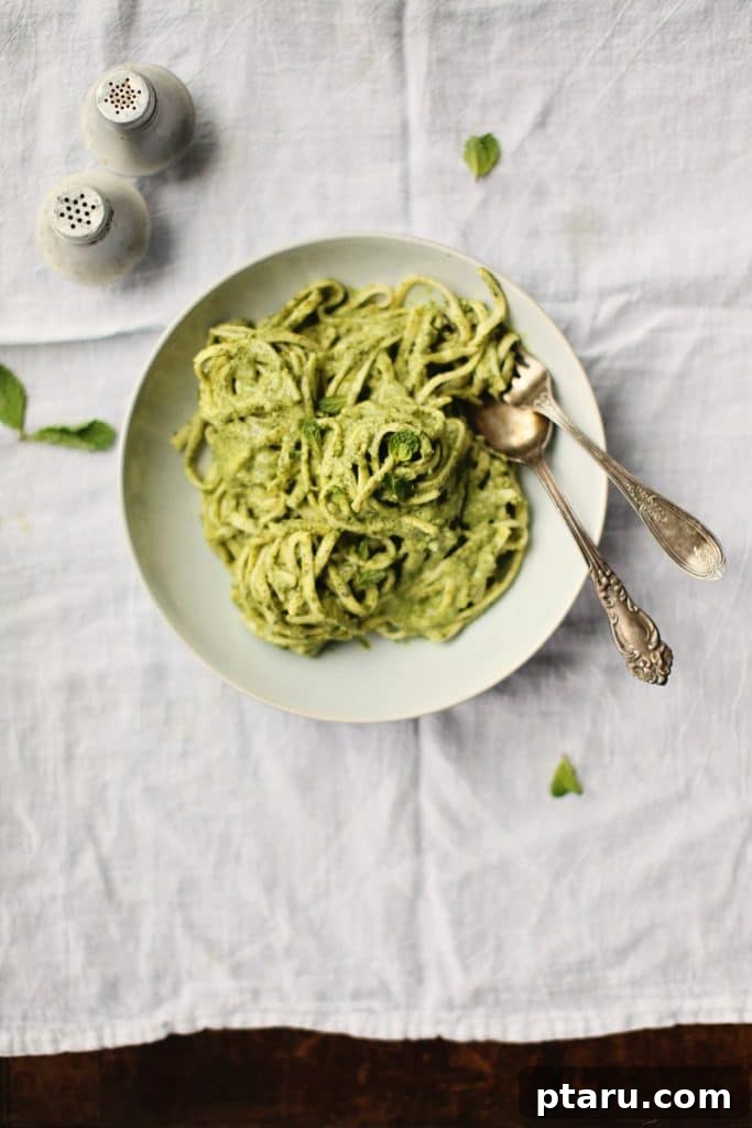 Beyond Basic The Webs Most Unique Pasta Creations 5 Linguine pasta tossed in a vibrant creamy green coconut sauce, garnished with fresh cilantro.
