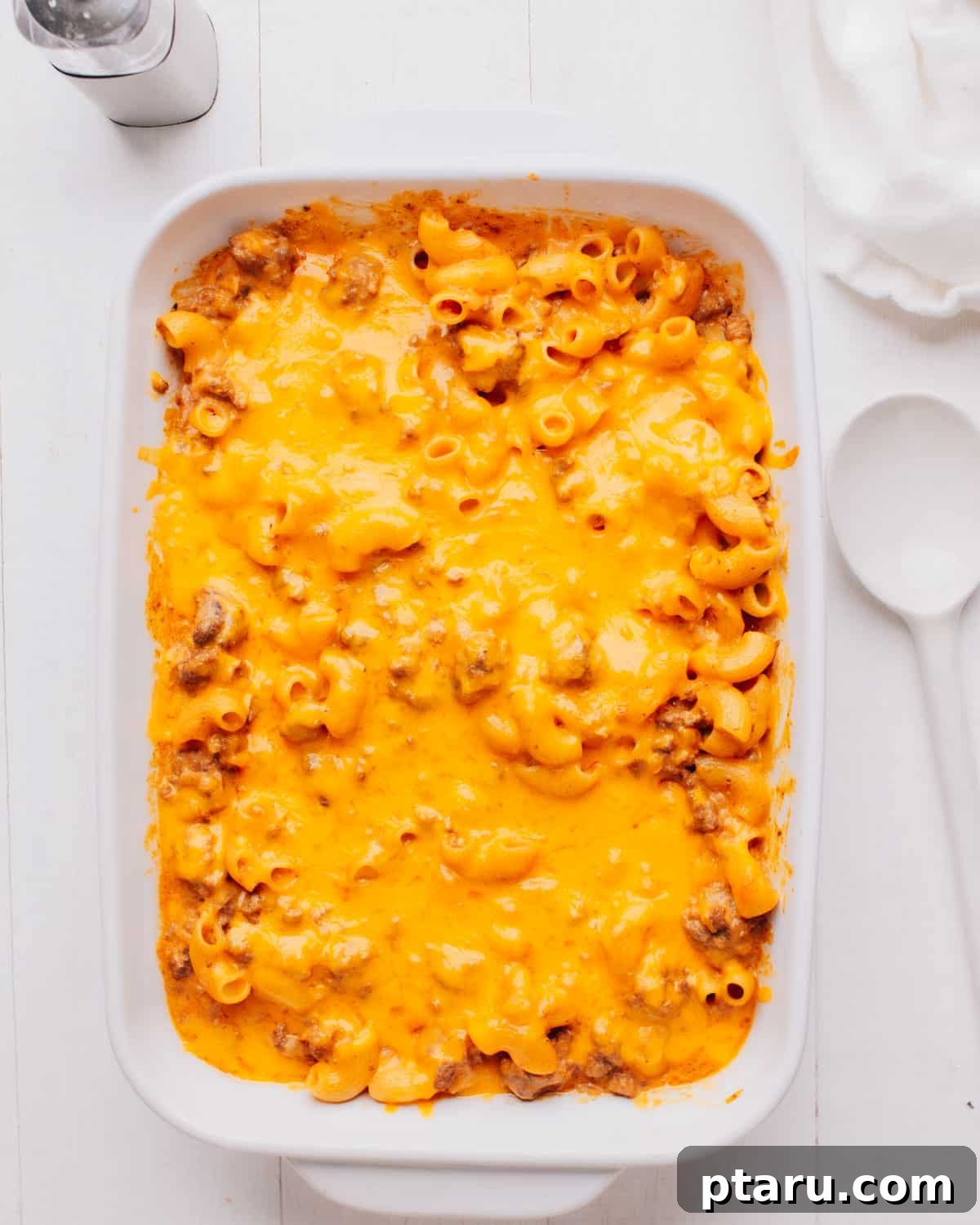 Beyond Basic The Webs Most Unique Pasta Creations 10 Hearty cheeseburger casserole in a large pan, bubbling with cheese and ready to serve.