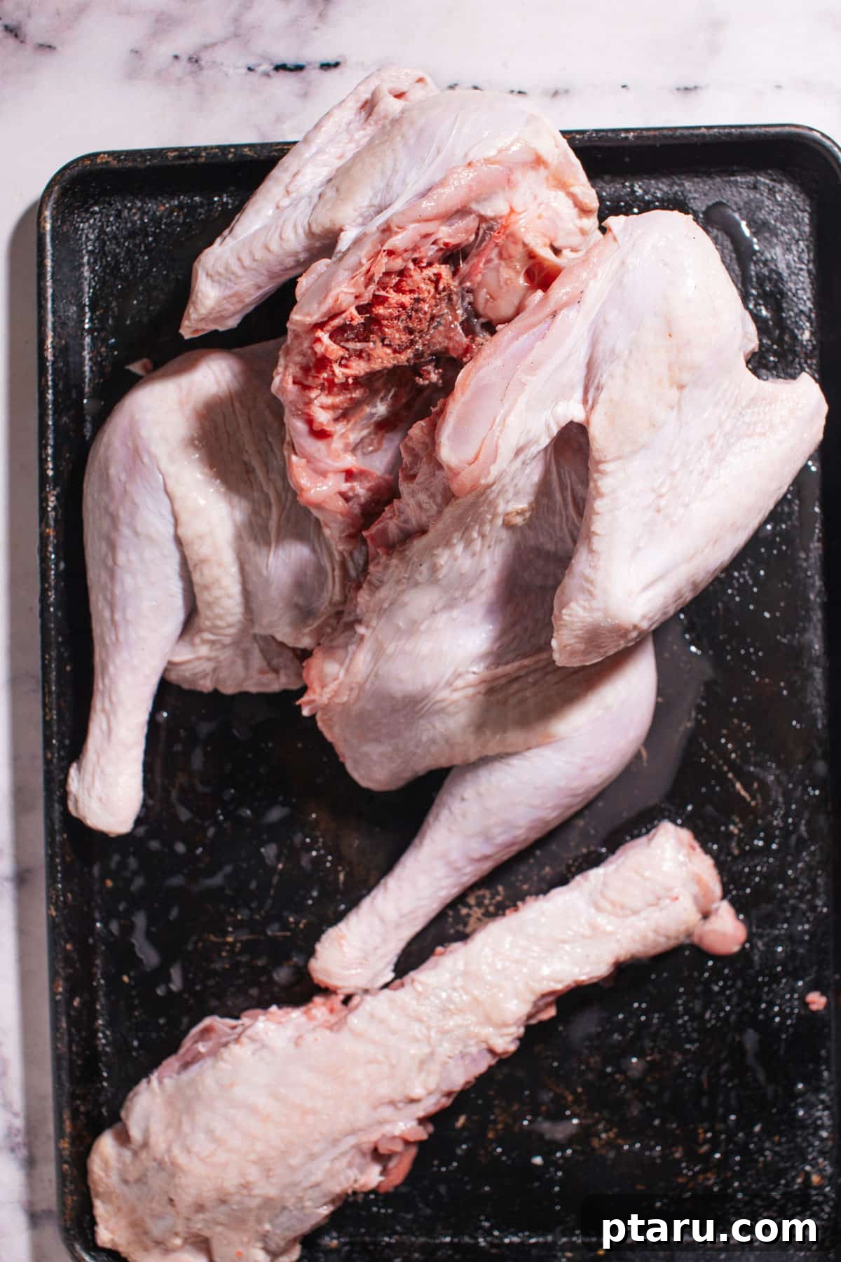Foolproof Spatchcock Turkey 4 Spatchcock turkey preparation step 2: flattening the bird.