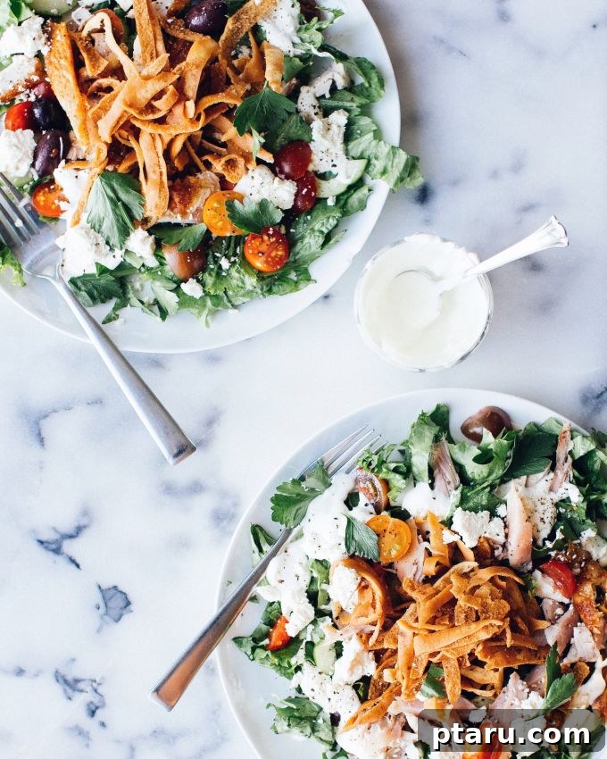 Zesty Chicken Fattoush with Creamy Garlic Yogurt Dressing 2 A perfectly golden-brown rotisserie chicken, ready to be carved for a convenient meal.