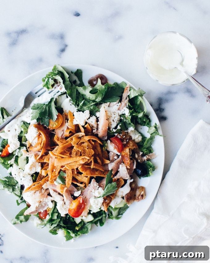 Zesty Chicken Fattoush with Creamy Garlic Yogurt Dressing 3 A vibrant and fresh Chicken Fattoush Salad generously topped with crispy pita croutons.