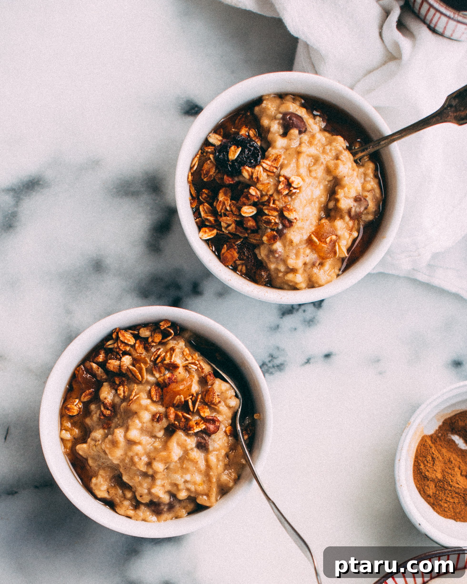 Wake Up To Pumpkin Spice Oats 3 A close-up shot of a slow cooker filled with creamy pumpkin spice steel-cut oatmeal, showcasing its rich texture.