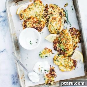 A beautifully presented stack of golden zucchini fritters.