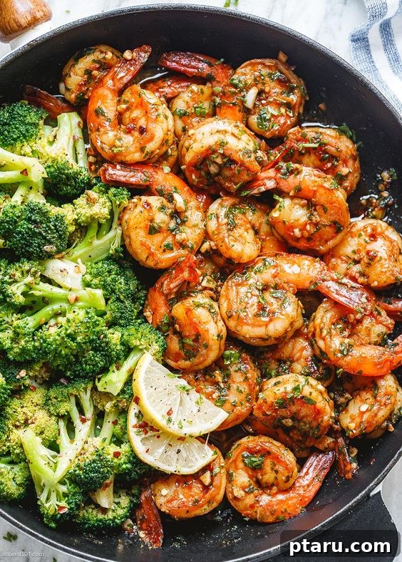 20+ Guilt-Free Shrimp Recipes for Dinner: Absolutely Delicious! 12 Garlic Butter Shrimp and Broccoli Skillet, cooked in a rustic cast iron pan.