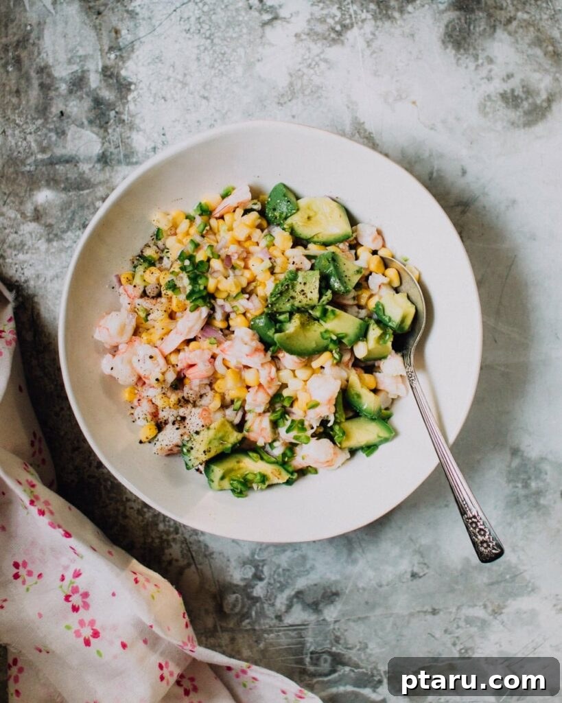 20+ Guilt-Free Shrimp Recipes for Dinner: Absolutely Delicious! 8 Shrimp Ceviche Recipe with Corn and Avocado in a bowl, served with tortilla chips.