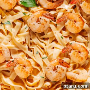 Close-Up Image of Creamy Shrimp Pasta, garnished with fresh herbs and a hint of lemon.
