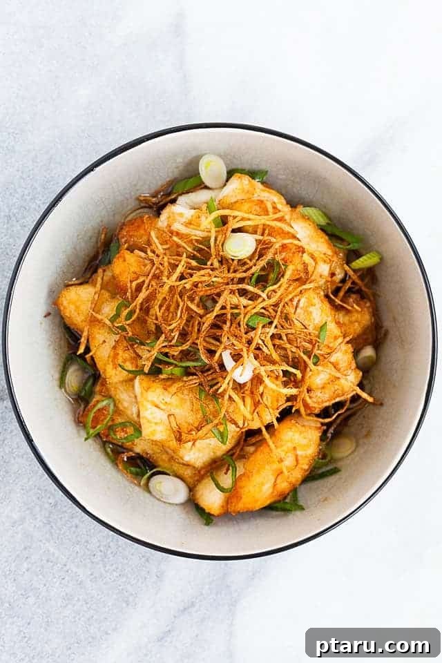 Halibut Perfection: Top Online Recipes 18 Pan-fried Ginger Soy Halibut garnished with crispy ginger and scallions.