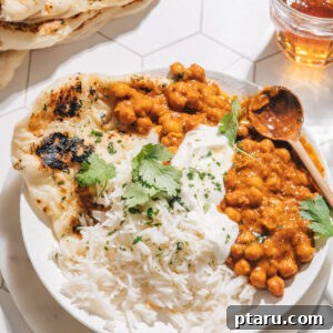 Speedy Coconut Chickpea Curry 8 Curry chickpeas with rice and naan, beautifully presented.