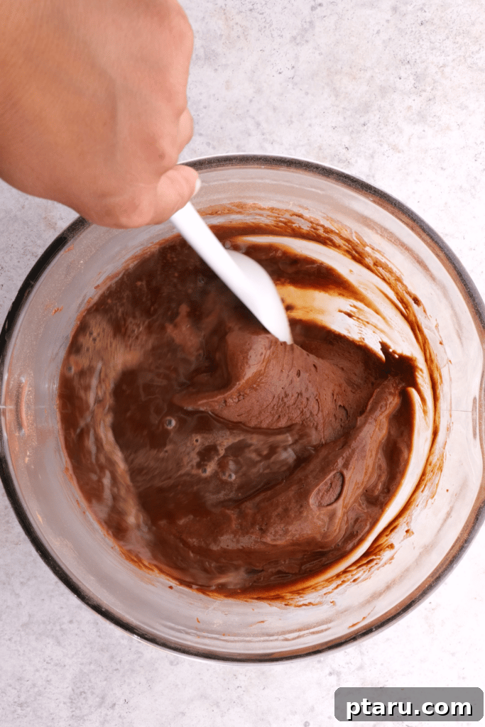 Festive Buche de Noel Yule Log 4 Mixing chocolate cake batter for Yule Log