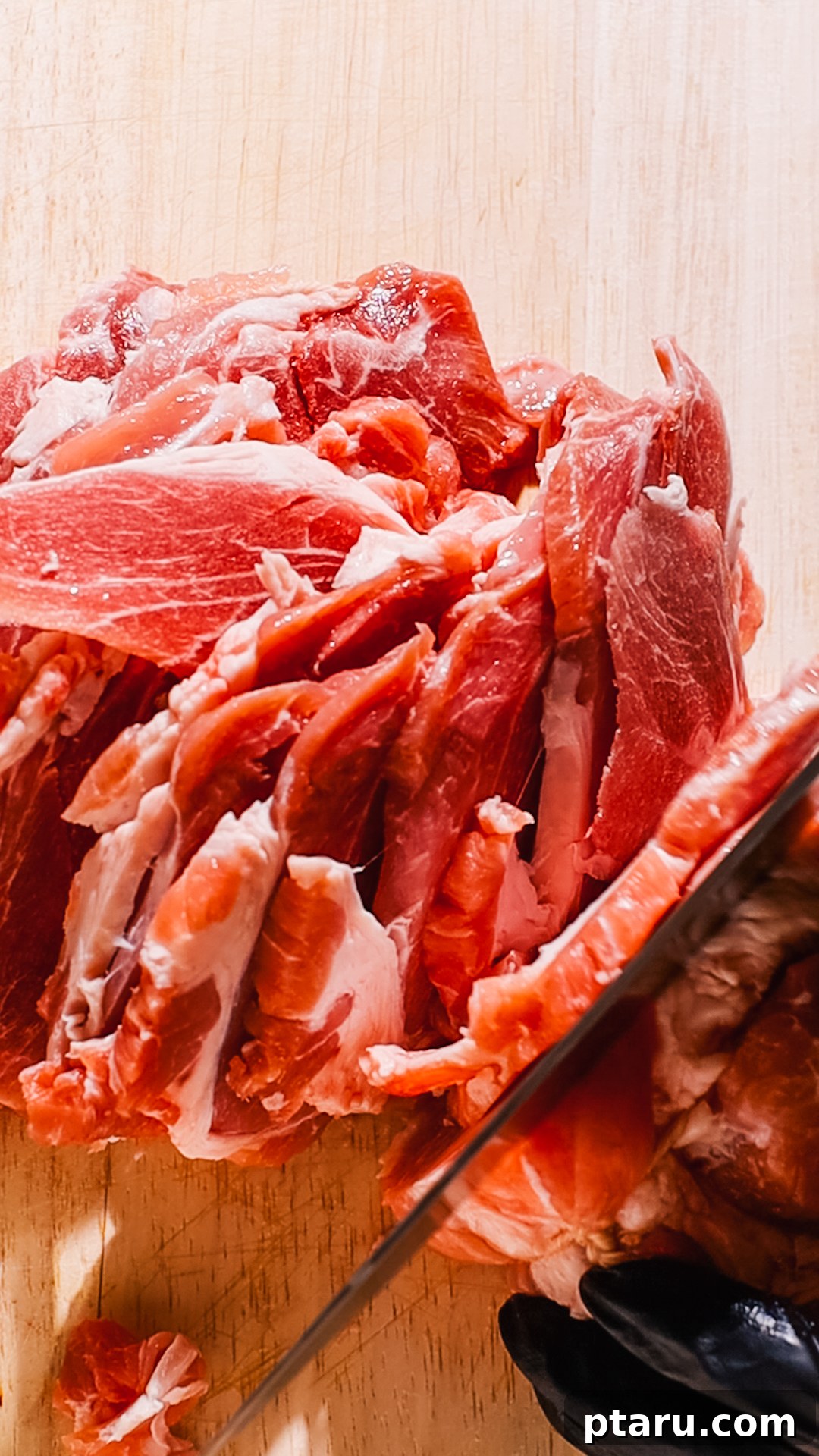 Effortless Tacos Al Pastor 4 Thinly sliced pork shoulder, ready for marinating