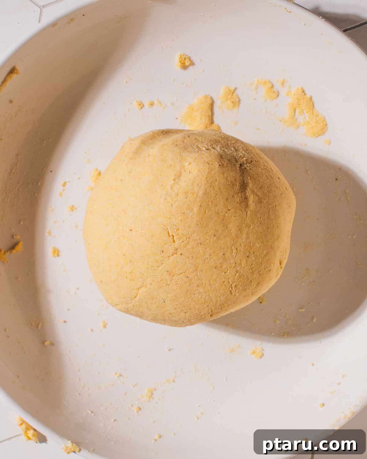 Perfectly Soft Homemade Corn Tortillas Made Easy 3 A visual display of the simple ingredients needed for homemade corn tortillas: masa harina, salt, and water