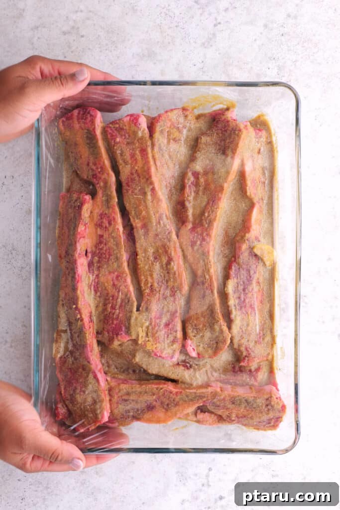 Mouthwatering Korean BBQ Short Ribs 4 Pouring the blended marinade ingredients onto the meat