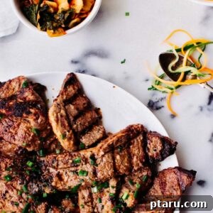 Grilled Korean Short Ribs on a plate with green onion garnish.