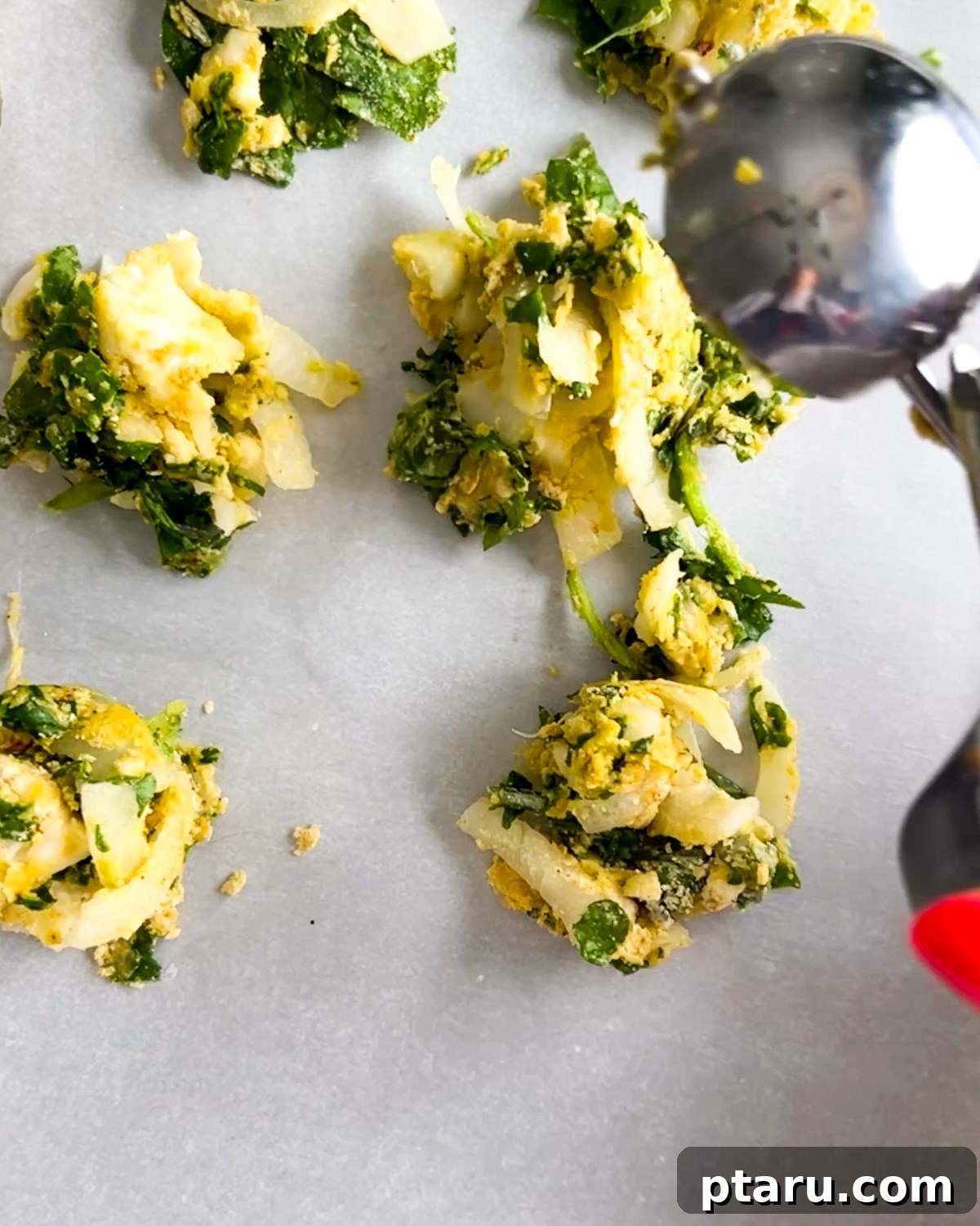 Easy Crispy Indian Pakora 5 Formed pakora balls ready for frying, showcasing the dense, spiced vegetable mixture.