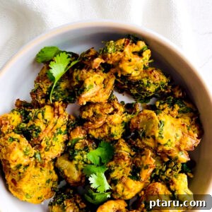 Easy Crispy Indian Pakora 9 Pakora in a bowl with cilantro.