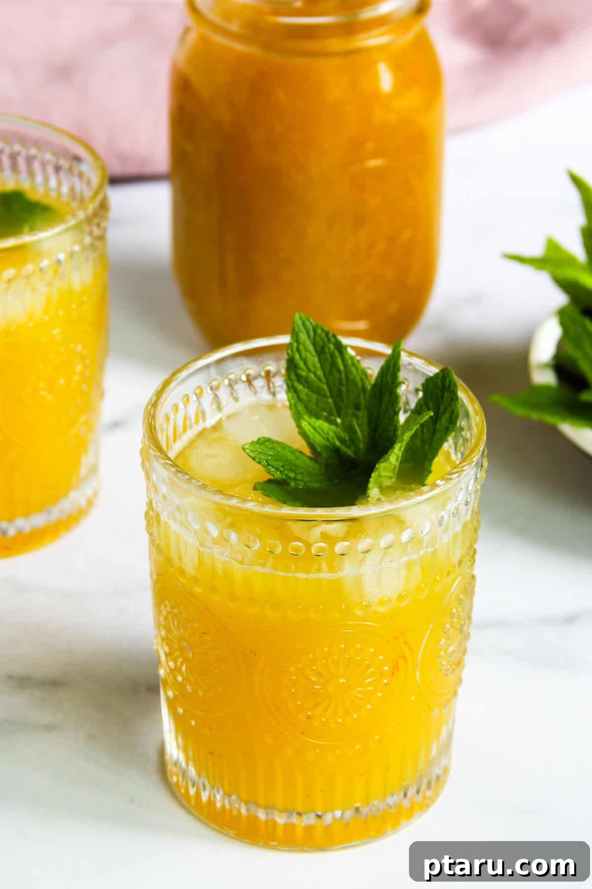 The Ultimate Guide to Indian Beverage Recipes 25 Aam Panna, a refreshing raw mango drink, served in a glass with mint.