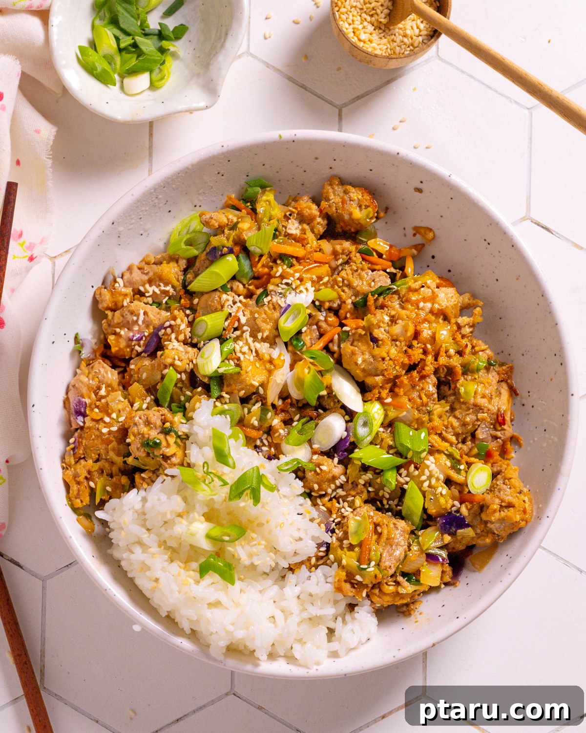 The Ultimate Ground Beef and Cabbage Recipe Collection 2 Egg Roll in a bowl with rice, featuring savory ground beef and tender cabbage.