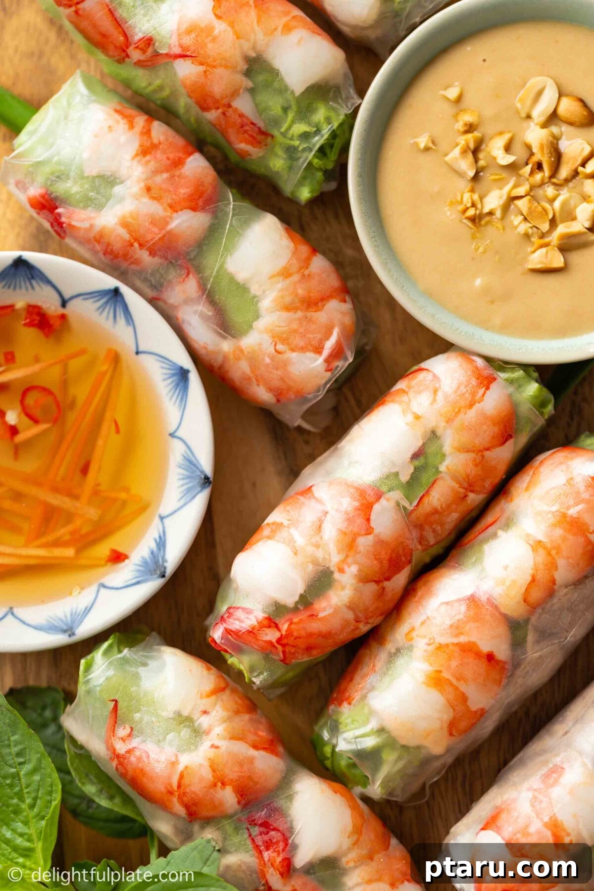 The Ultimate Ground Beef and Cabbage Recipe Collection 11 Golden-brown Easy Beef and Cabbage Spring Rolls with dipping sauce.