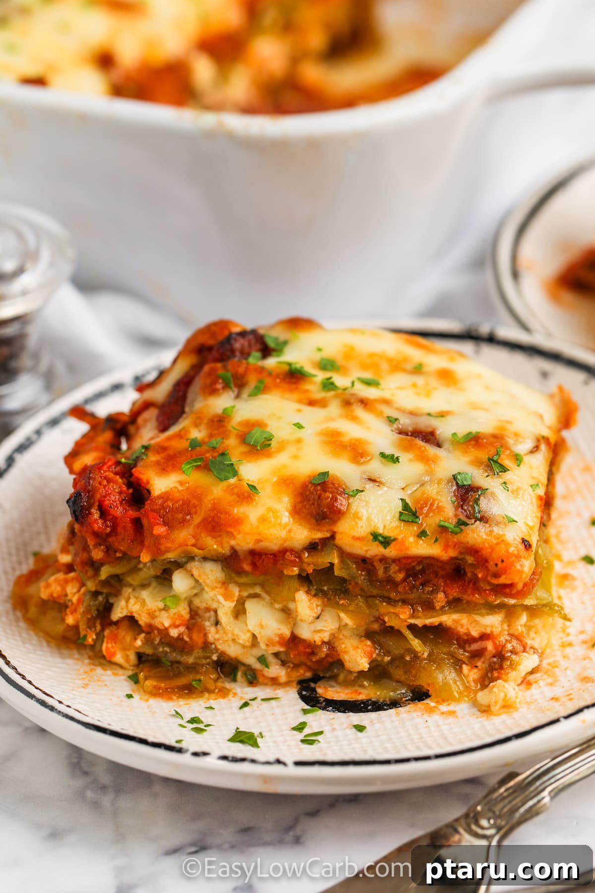The Ultimate Ground Beef and Cabbage Recipe Collection 6 Sliced Beef and Cabbage Lasagna, revealing layers of meat, cabbage, and cheese.