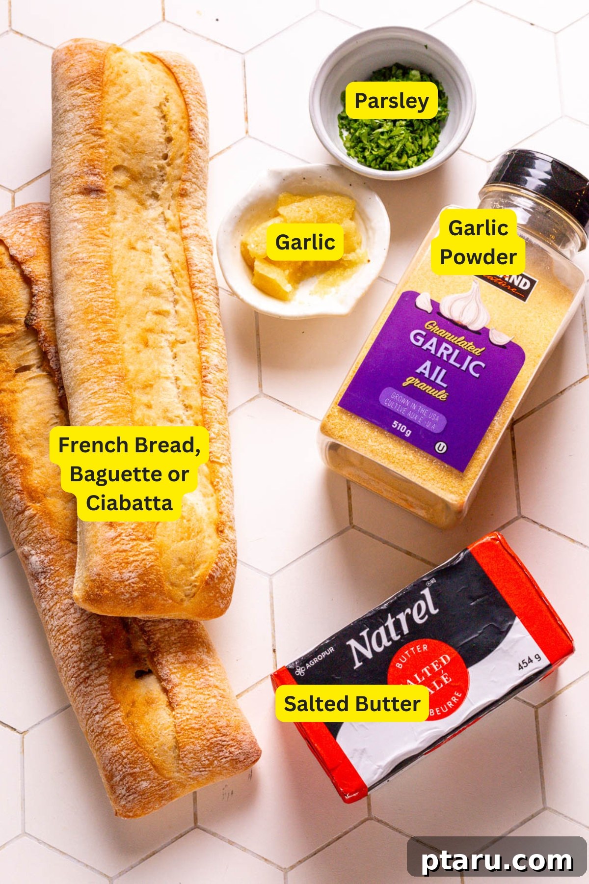 Homemade Garlic Bread That Outshines Restaurants 3 Fresh ingredients laid out for homemade garlic bread: bread, butter, garlic, and parsley