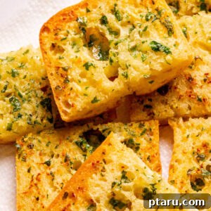 homemade garlic bread on a plate.