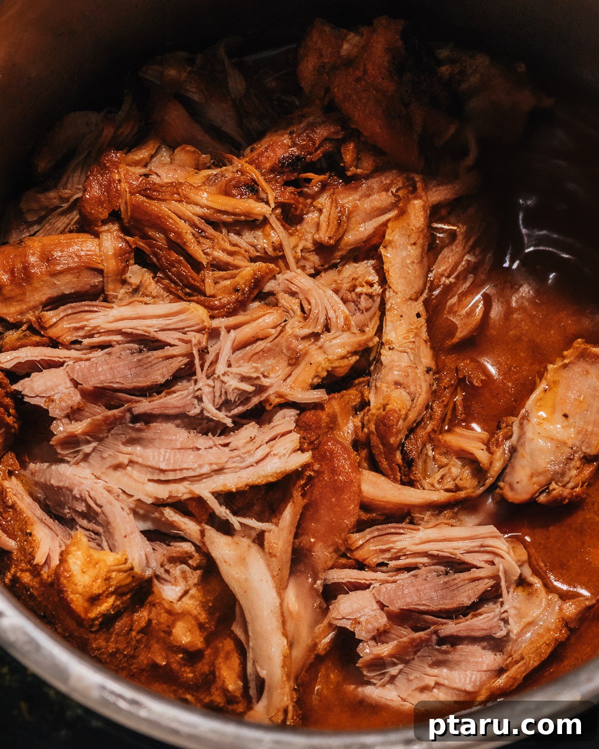 Effortless Instant Pot Fall-Apart Pulled Pork 2 Perfectly tender Instant Pot Pulled Pork, ready to be served on a platter.