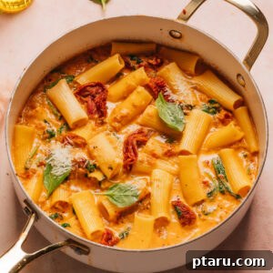 Rustic Tuscan Chicken Pasta 8 Tuscan Chicken Pasta in a saucepan.