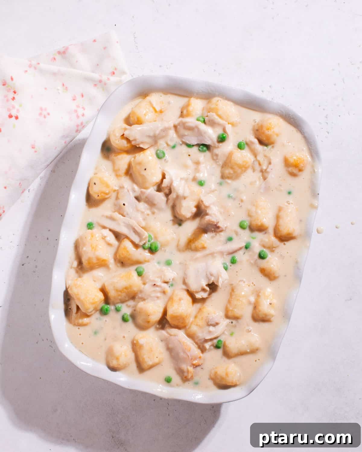 Deliciously Easy Chicken Tater Tot Casserole 7 Unbaked Tater Tot casserole with chicken, ready for the oven.