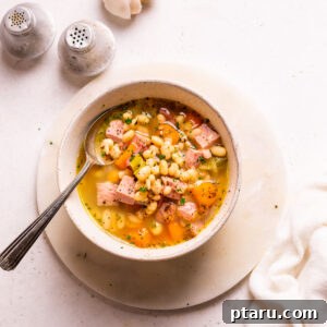 Ham and Bean Soup in a bowl with a spoon.