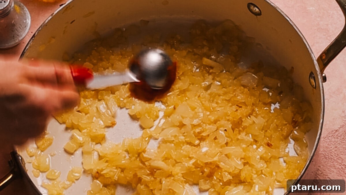 30 Minute One Pot Creamy Tortellini Soup 4 Step 1: Sautéing diced onions in olive oil until translucent.
