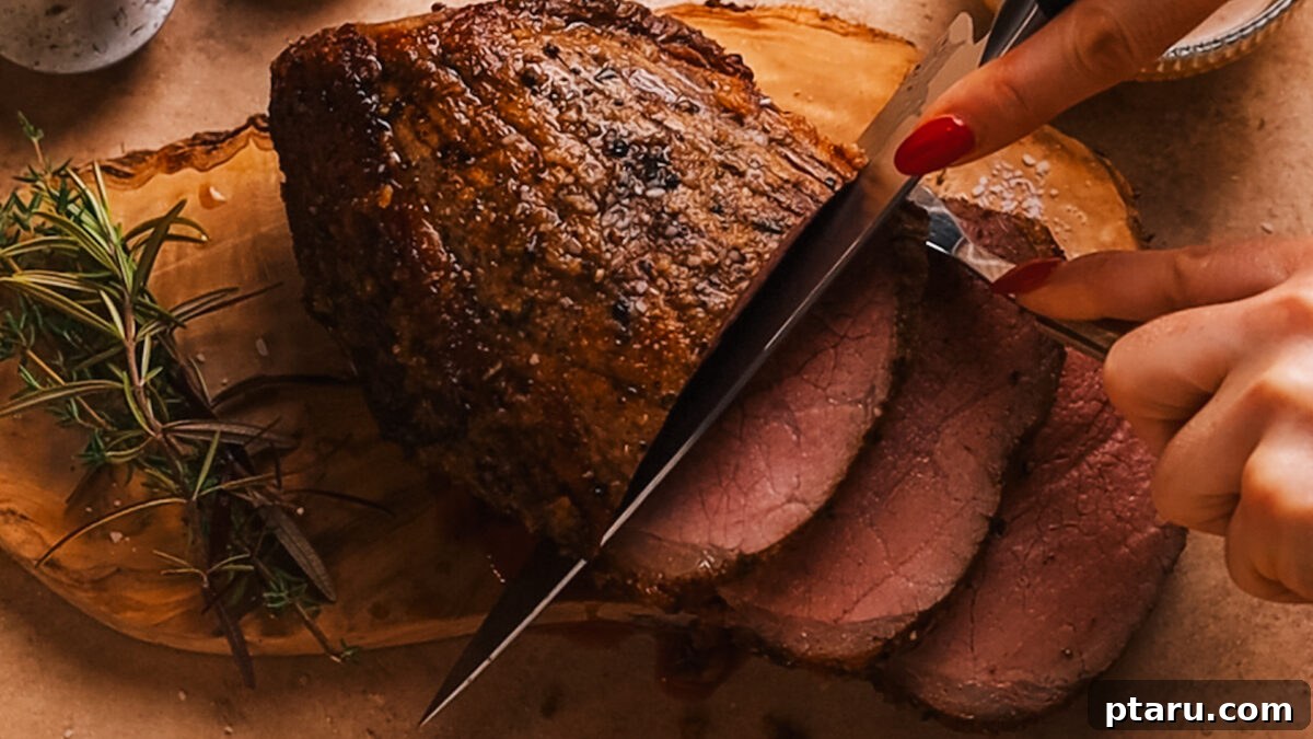 Melt-in-Your-Mouth Eye of Round Roast 8 Slicing the rested Eye of Round Roast against the grain.
