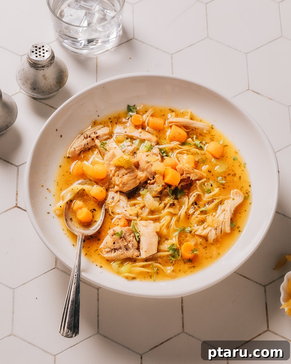 Best Ever Quick Instant Pot Chicken Soup 7 Instant Pot Chicken Soup in a white bowl with fresh parsley