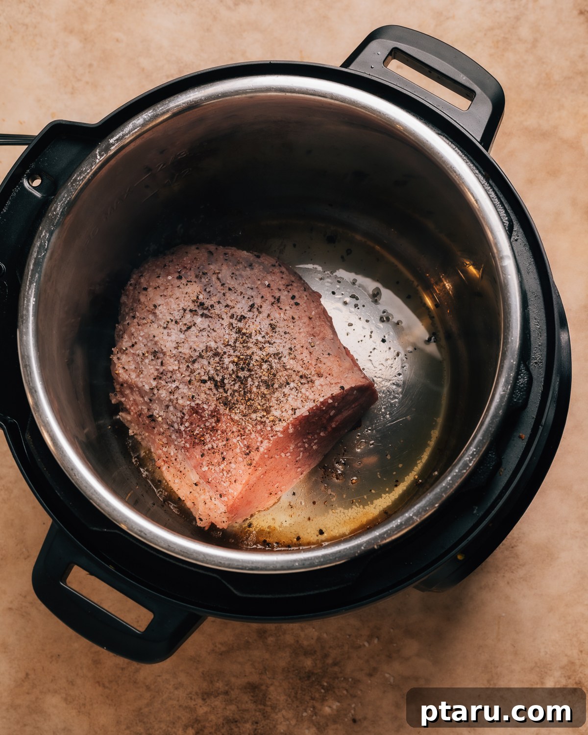 Ultra-Tender Instant Pot Roast Beef 4 Large cut of raw beef seasoned with salt and pepper, ready for searing in an Instant Pot