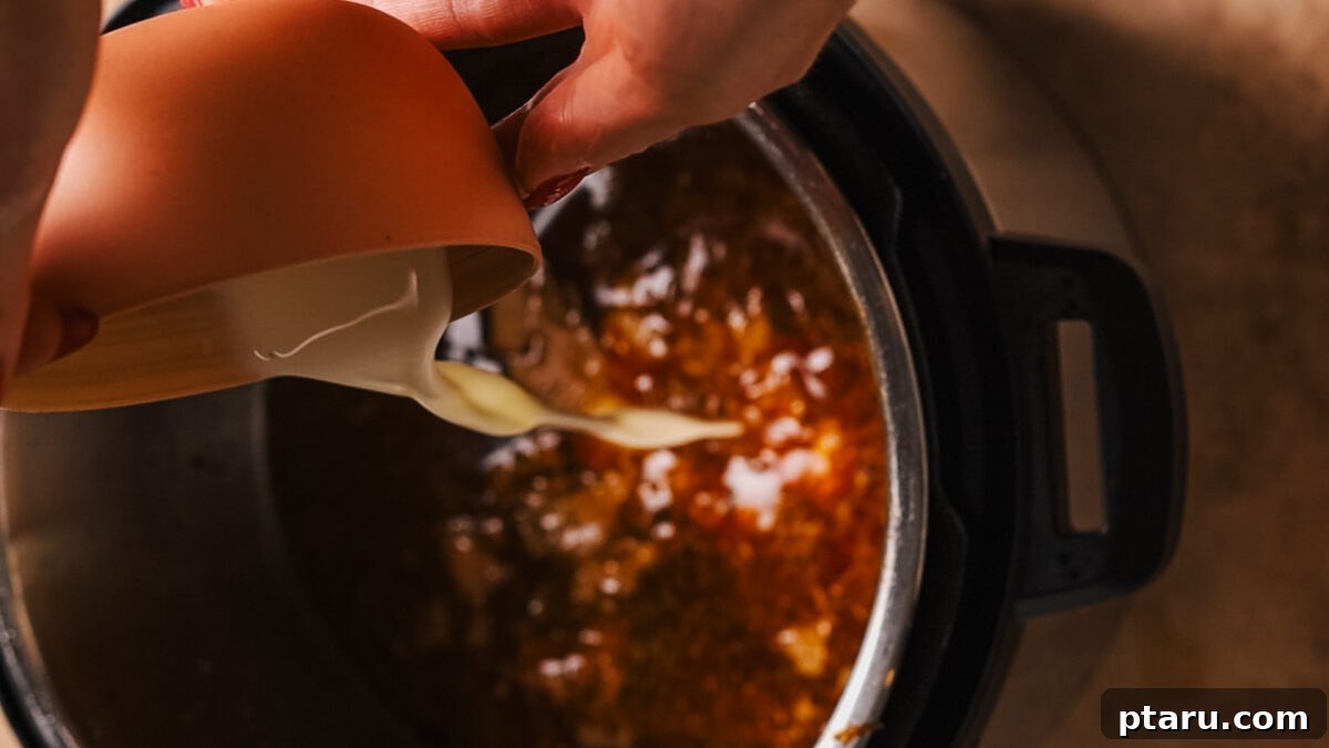 Ultra-Tender Instant Pot Roast Beef 9 Cornstarch slurry being stirred into the cooking liquid in the Instant Pot to thicken gravy