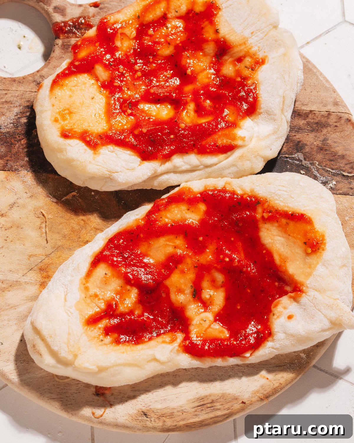 10-Minute Flatbread Pizza Magic 3 Pizza sauce spread on a flatbread base