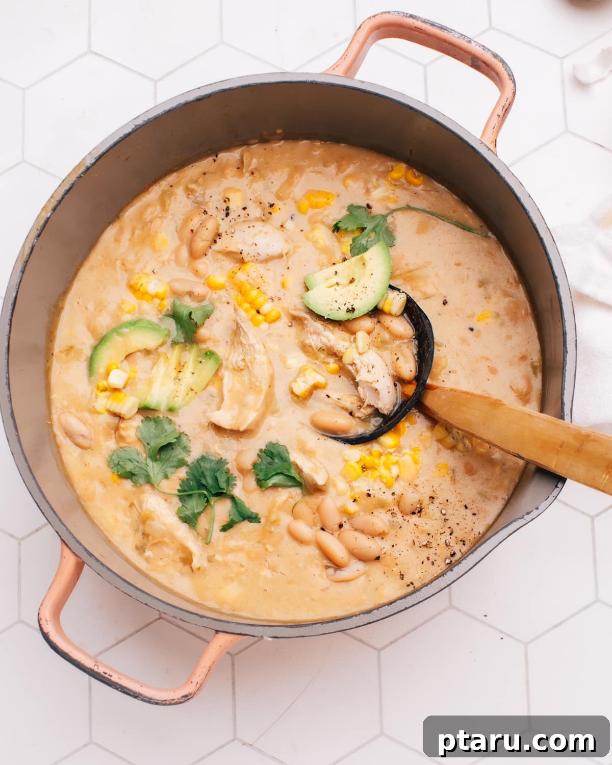 28 Plus Healthy Chicken Recipes Made Easy Delicious and Dietitian Endorsed 25 Healthy white chicken chili served in a dutch oven, garnished with fresh cilantro.