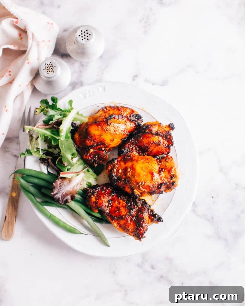 28 Plus Healthy Chicken Recipes Made Easy Delicious and Dietitian Endorsed 27 Perfectly cooked Air Fryer Boneless Chicken Thigh on a plate.