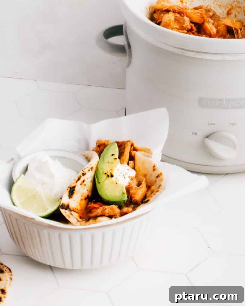 28 Plus Healthy Chicken Recipes Made Easy Delicious and Dietitian Endorsed 10 Easy shredded (pulled) chicken tacos cooked in a crockpot with a delicious sauce, ready to be assembled.