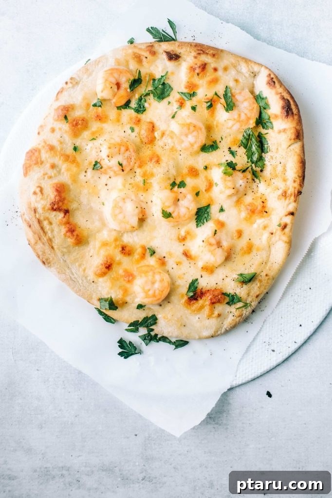Over 40 Easy Christmas Bites Your Guests Will Devour 21 Shrimp Pizza with a Garlicky Cream Sauce.