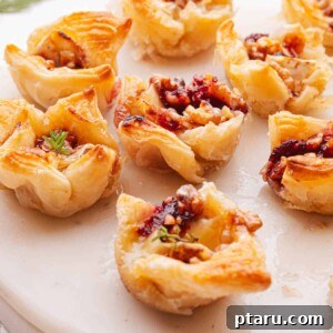 Over 40 Easy Christmas Bites Your Guests Will Devour 32 Brie Appetizer on a plate.
