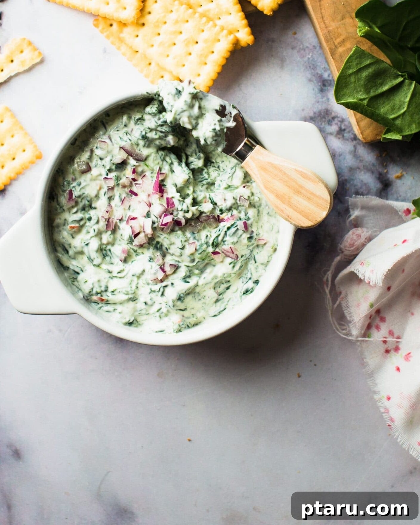 Over 40 Easy Christmas Bites Your Guests Will Devour 6 Spinach dip with crackers.