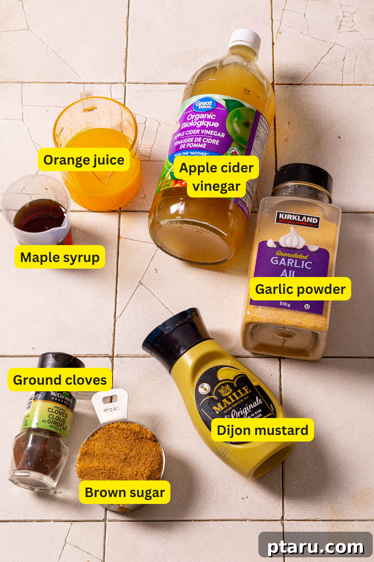Irresistible Ham Glaze 3 Ingredients for ham glaze including brown sugar, maple syrup, orange juice, Dijon mustard, apple cider vinegar, garlic powder, and ground cloves.