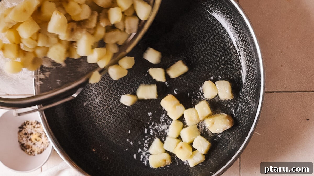 Crispy Fluffy French Fries 6 Adding par-boiled potatoes to hot oil