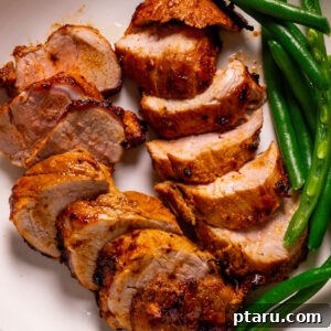 Air Fryer Pork Tenderloin Unbelievably Tender 12 Air fryer pork tenderloin recipe plated with green beans.