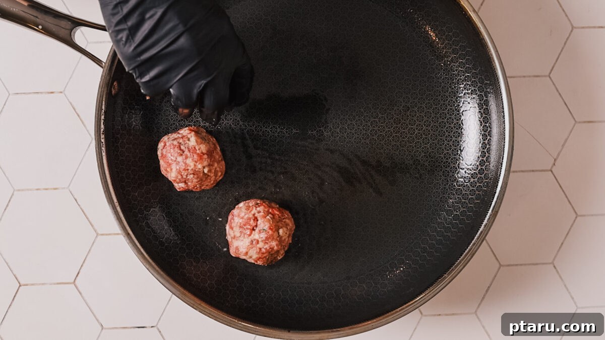 The Secret to Irresistible Meatballs 11 Browning meatballs in a skillet until golden on all sides.