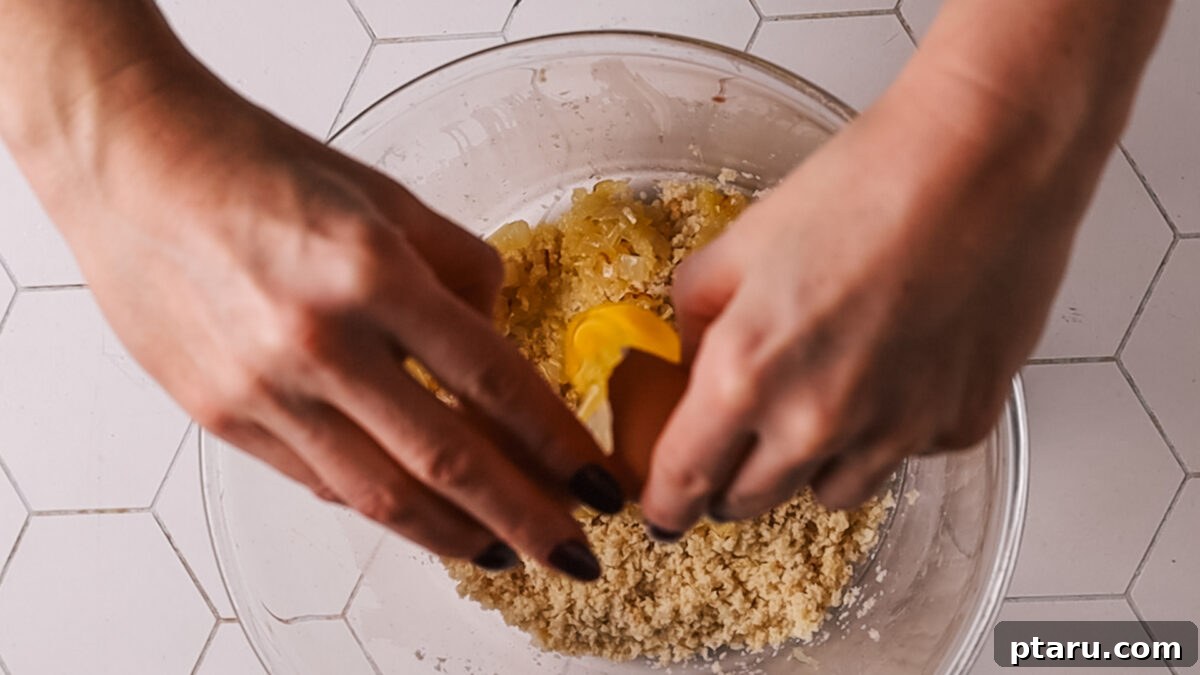 The Secret to Irresistible Meatballs 8 Mixing eggs into the breadcrumb and aromatic mixture.